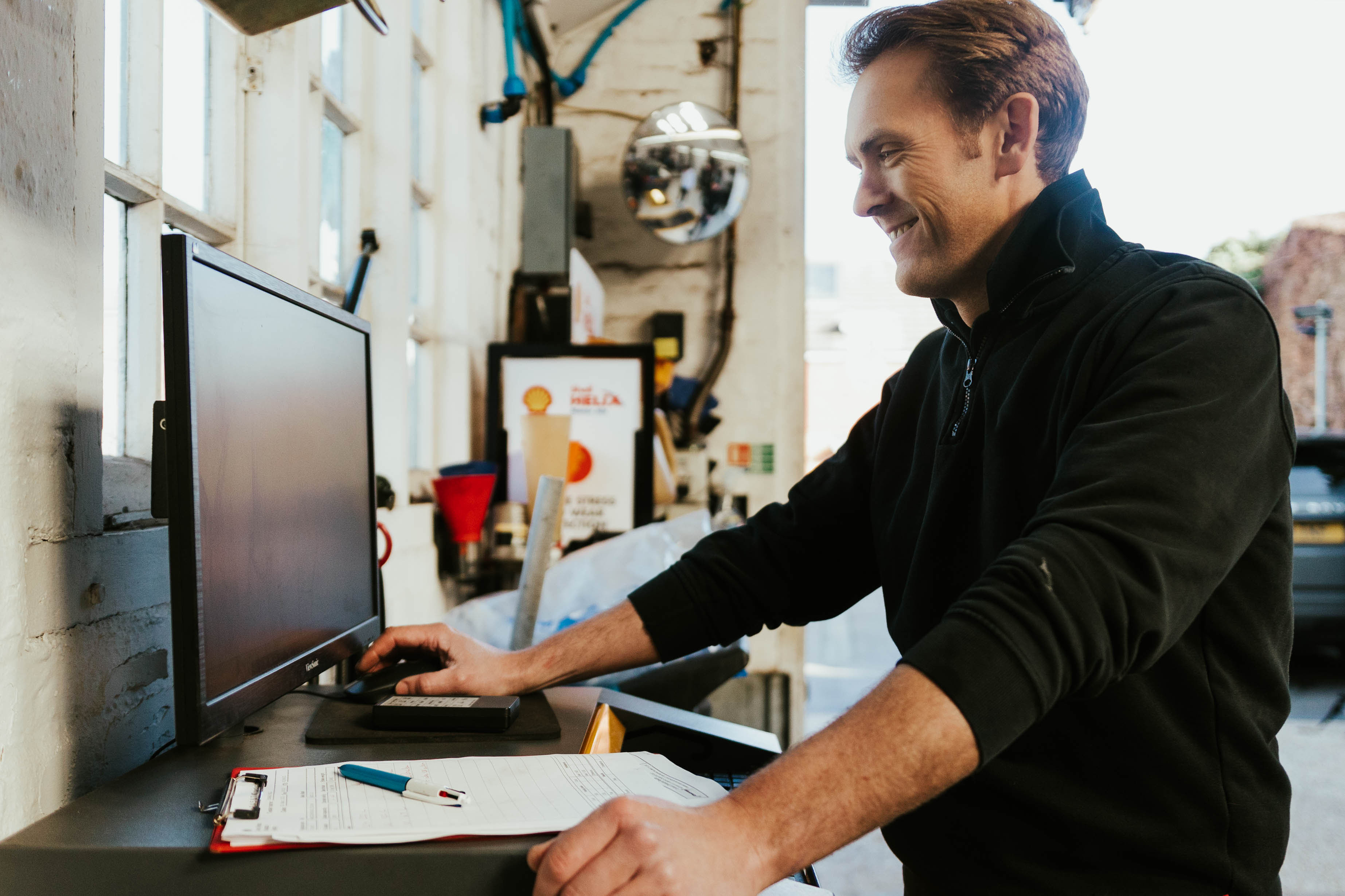 Mechanic performing MOT inspection
